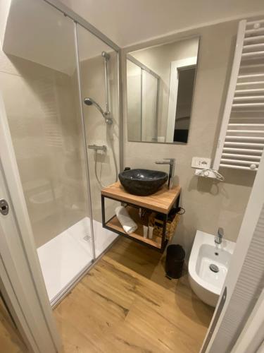 a bathroom with a sink and a shower and a toilet at Claustro Segreto - ALTAMURA in Altamura