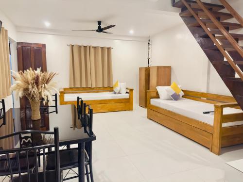 Krevet ili kreveti u jedinici u okviru objekta Palmera El Nido Inn