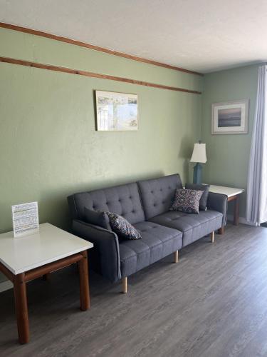 a living room with a couch and a table at Unit 225 Beautiful Cedar key in Cedar Key