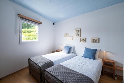 Postel nebo postele na pokoji v ubytování Casa Sol Nascente