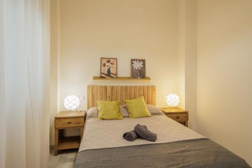 Ένα ή περισσότερα κρεβάτια σε δωμάτιο στο Don Fadrique Macarena