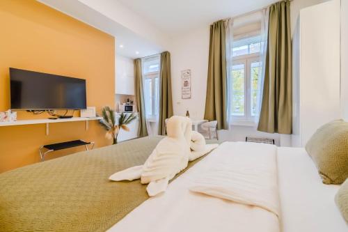 Voodi või voodid majutusasutuse Central Boutique Apartments LuAn toas