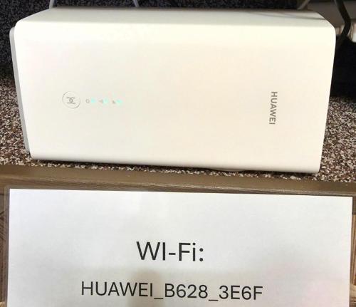 a white laptop computer sitting on top of a table at Slāvu Dzīvoklis in Rīga