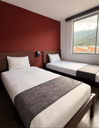 Ένα ή περισσότερα κρεβάτια σε δωμάτιο στο HOTEL RIVERA CENTRAL