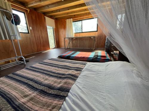 Postel nebo postele na pokoji v ubytování Cabaña nueva