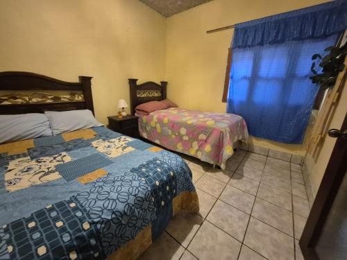 Ένα ή περισσότερα κρεβάτια σε δωμάτιο στο Casa El Recuerdo