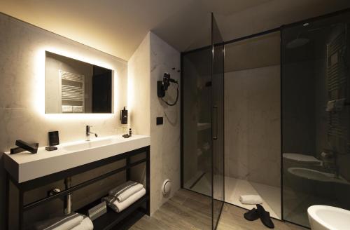 a bathroom with a sink and a shower at 7BA Hotel Milano in Milan