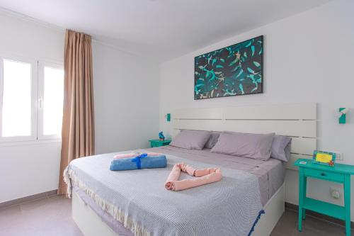 En eller flere senge i et værelse på Casa Camilla Alisios Playa