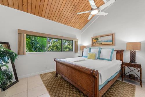 a bedroom with a bed and a ceiling fan at Kahana Village 34 · KHV 34 Direct Ocean Front Views 2BD Kahana C in Kahana