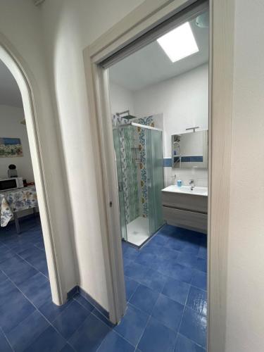 a bathroom with a tub and a sink and a mirror at Dimora del Verde in Forio d'Ischia