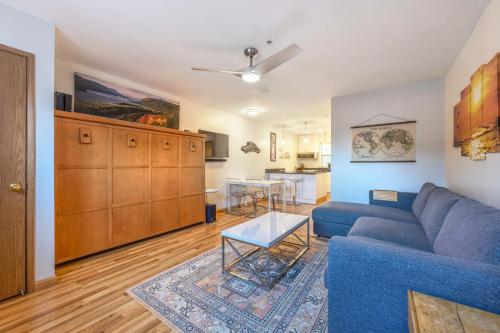 a living room with a blue couch and a kitchen at 08 Lodge in Hood River