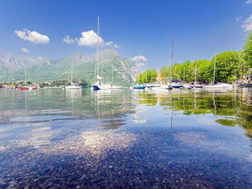 a large body of water with boats in it at Center House Via Anghileri in Lecco