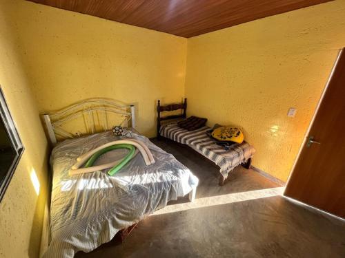 Ένα ή περισσότερα κρεβάτια σε δωμάτιο στο Solar Serra das Piteiras - Paivas Pará de Minas