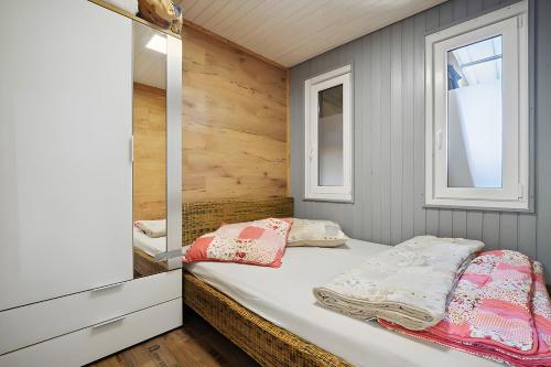 Ένα ή περισσότερα κρεβάτια σε δωμάτιο στο Ferienhaus 204