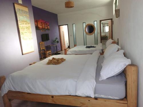 Ένα ή περισσότερα κρεβάτια σε δωμάτιο στο Hotel Restaurant Fitahiana Logde Ampefy - Site 1 Andakana