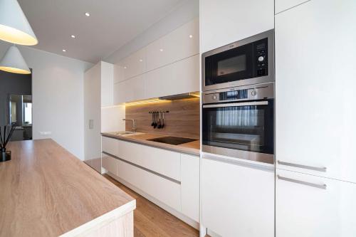 Η κουζίνα ή μικρή κουζίνα στο Marijonų Apartamentai