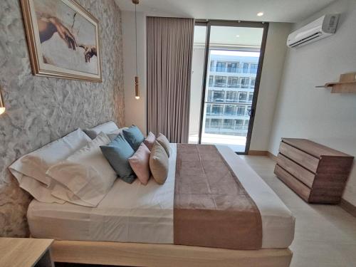 Una cama o camas en una habitación de Apart Suítes Stay Morros EOS - Acceso directo a la playa