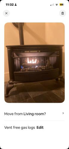 a fire in a fireplace in a room at Charleston, SC themed - PRIVATE 1 QUEEN BED 1 BATH APARTMENT 2 FUTONS THAT FOLD OUT FLAT TO SLEEP ON & LEATHER LOVE SEAT GAS LOGS IN LIVING ROOM FULL KITCHEN POKER BUMPER POOL TABLE CONVENIENTLY LOCATED IN COLUMBIA SOUTH CAROLINA 1 QUEEN BED & 2 SOFA BEDS in Columbia