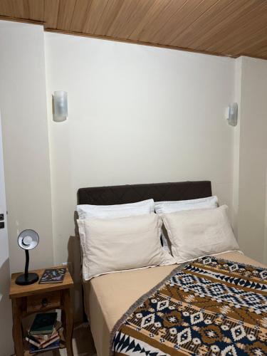 Ένα ή περισσότερα κρεβάτια σε δωμάτιο στο Apartamento Aconchegante em Urubici com 02 suítes