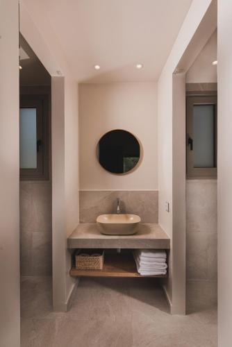 a bathroom with a sink and a mirror at Alkinari Villa, by TK Premium Stays in Vasilikos
