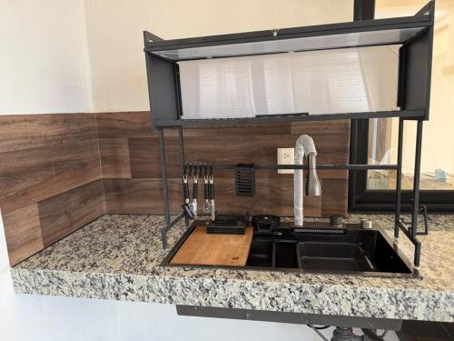 Een keuken of kitchenette bij Suite La Lomita #3 Climatizada