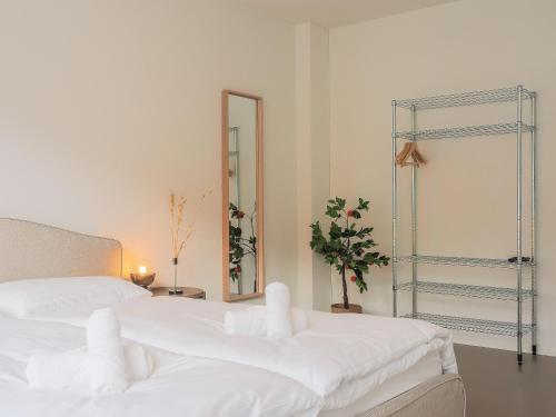 Ένα ή περισσότερα κρεβάτια σε δωμάτιο στο Stilvoll & zentral in St Gallen -WYBA Living Rio