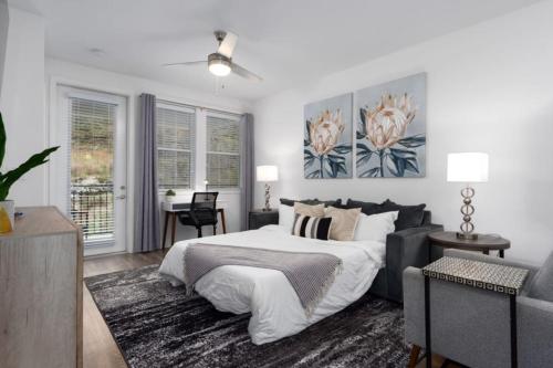 a bedroom with a bed and a couch at Stylish Stay Off I-65, Pets Welcome in Acton