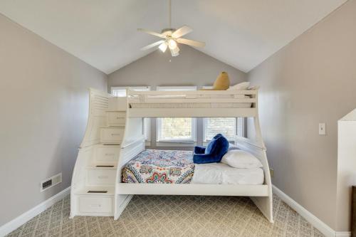 a white bunk bed in a room with a ceiling fan at 6 Mi to Dtwn Anderson Grand Family Home with Yard! in Anderson