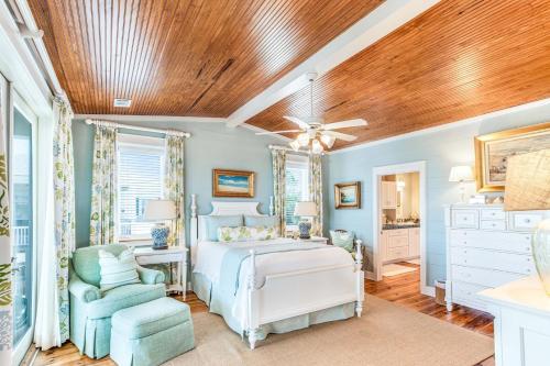 a bedroom with a bed and a ceiling fan at Tenth Street Retreat in Tybee Island
