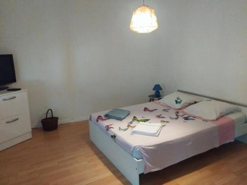 Postel nebo postele na pokoji v ubytování L'Arlequin