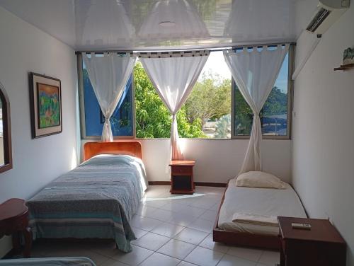 Postel nebo postele na pokoji v ubytování Condominio, Cabaña 202