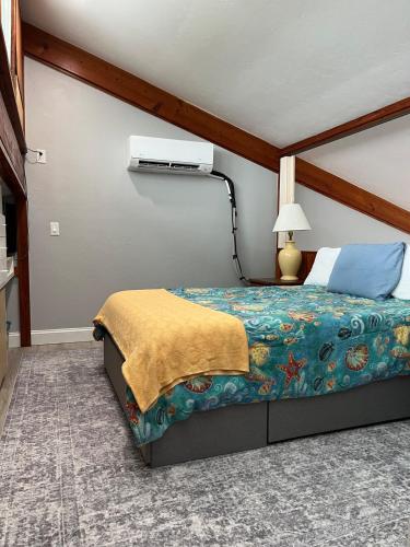 a bedroom with a bed and a lamp at Sunset Vista Condo 328 in Cedar Key