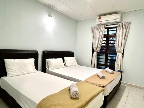 Postel nebo postele na pokoji v ubytování Asean Villa Afamosa