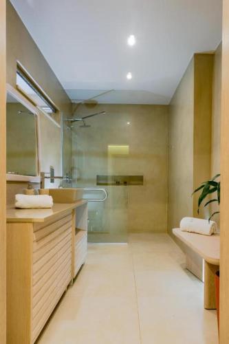 a bathroom with a sink and a glass shower at Upper View Villa, with private pool in Chania