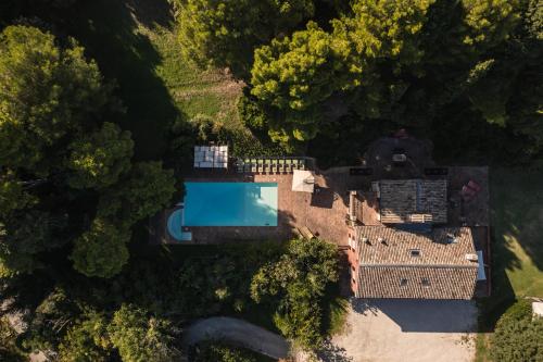 an overhead view of a house with a swimming pool at Villa Adele - Historic Dimora with pool & sea view in Senigallia