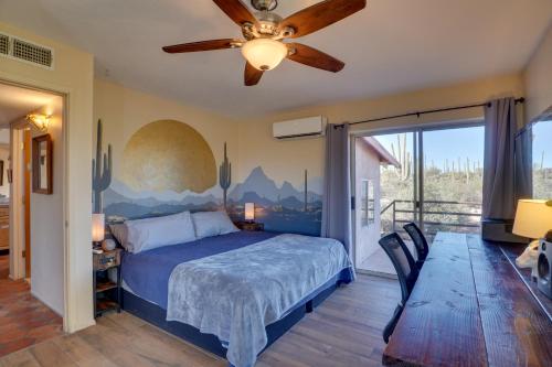 a bedroom with a bed and a ceiling fan at Pool and Stunning Mtn Views! Eclectic Tucson Home in Tucson