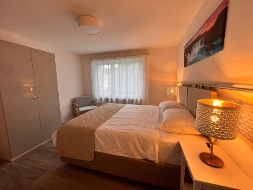 Postel nebo postele na pokoji v ubytování Moderne & helle Wohnung mit Netflix & Bergsicht