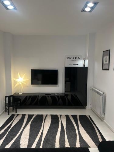 a living room with a flat screen tv on a wall at Casa di Eva in Reggio Calabria