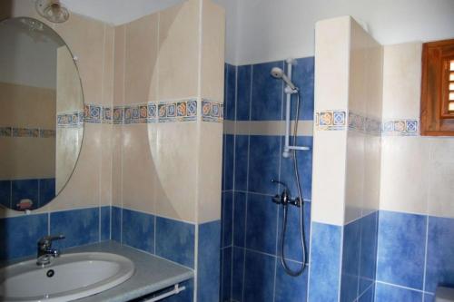 a bathroom with a shower and a sink at GITES MARLYSE in Bouillante