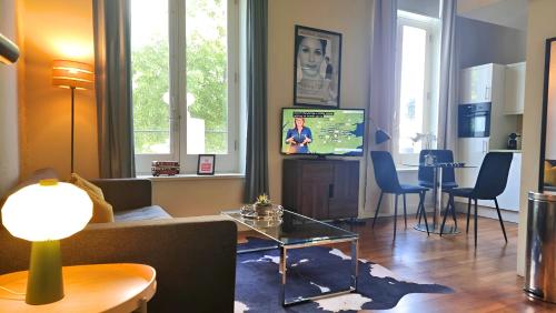 a living room with a couch and a table at Notting Hill - The One One One!!! -3- in London