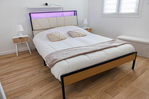 Postel nebo postele na pokoji v ubytování Le Soleil Cormeillais