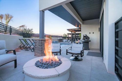 a fire pit on a patio with a couch and chairs at 29-30 | 2 Connected Homes in Ocotillo Springs with Pool and Spas in Santa Clara