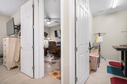 a room with a closet with white doors at Goodyear Retreat Pool Slide Firepit BBQ in Perryville