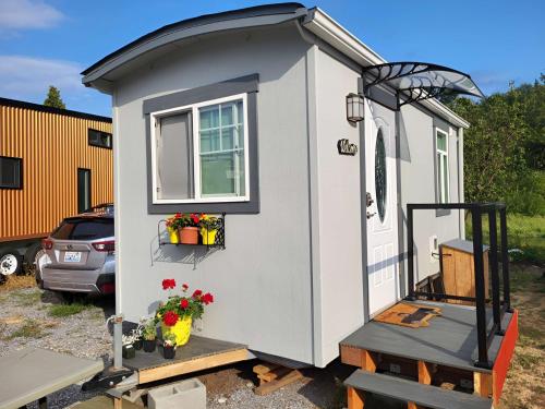 a tiny house with a door and a window at Caravan Across The Street From The Beach in Blaine