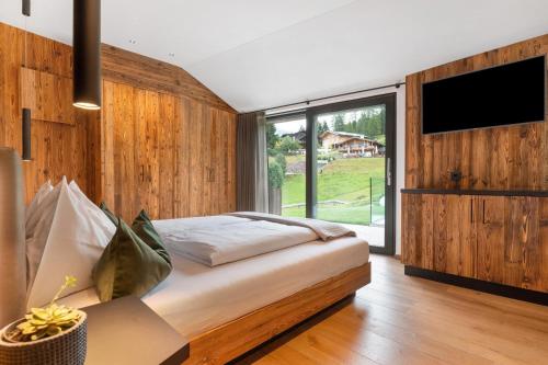 Ένα ή περισσότερα κρεβάτια σε δωμάτιο στο Chalet L Piz Dolomites