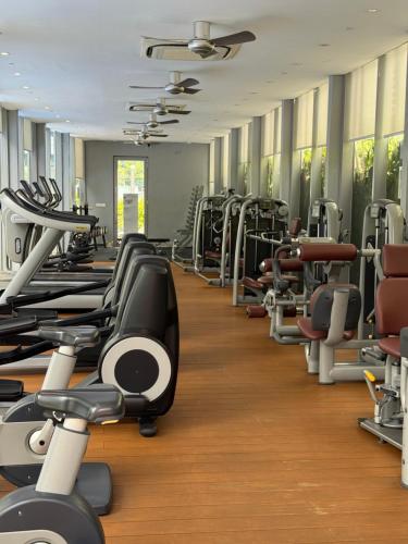 a gym with many rows of tread machines at vortex luxury apartment klcc in Kuala Lumpur
