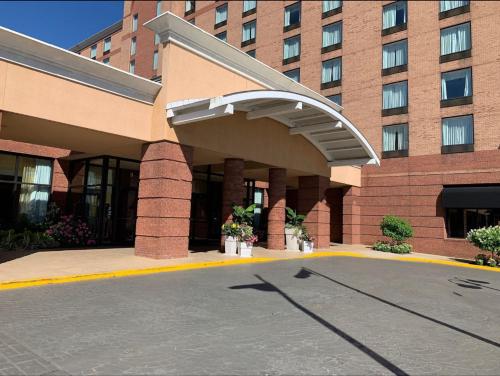 a building with a parking lot in front of it at Lynchburg Grand Estate by IHG in Lynchburg