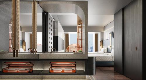 a bathroom with a sink and a bed at Hotel Indigo Zhuhai Xiangzhou by IHG in Zhuhai