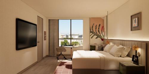 TV a/nebo společenská místnost v ubytování Atwell Suites Hefei City Center by IHG