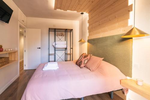 a bedroom with a large bed in a room at La Palomilla in Avila